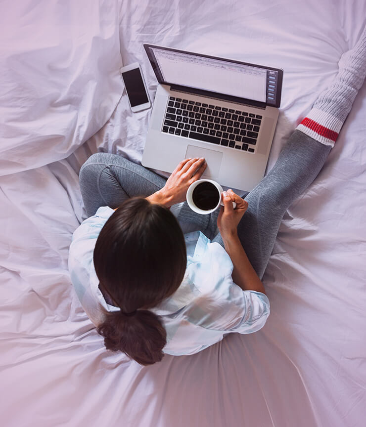 woman on laptop with coffee